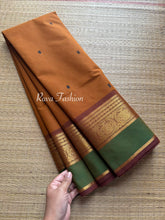 Dual shade of honey shade with contrast green and brown border with handmade thread buttas