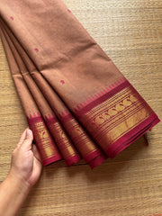 Biscuit shade Kanchi cotton saree with contrast Zari border & handmade thread buttas