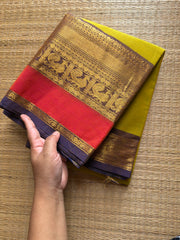Lemon Yellow shade Kanchi cotton saree with contrast big Zari border