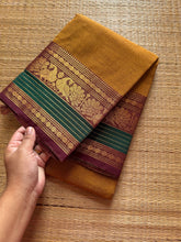 RF179 Mustard with contrast brown and green peacock pattern Kanchi cotton saree