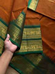 RF1137 Burnt Orange shade with green combination Rettapet border Kanchi cotton saree