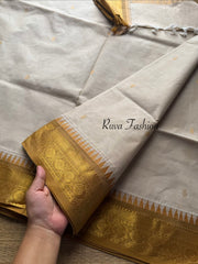 Cream with mustard combination Kanchi cotton saree with rich Zari woven Pallu and handmade golden Zari Buttas