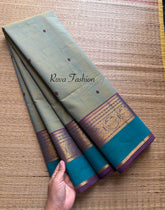 Dual shade of light dusty olive shade Kanchi cotton saree with contrast border and handmade thread buttas