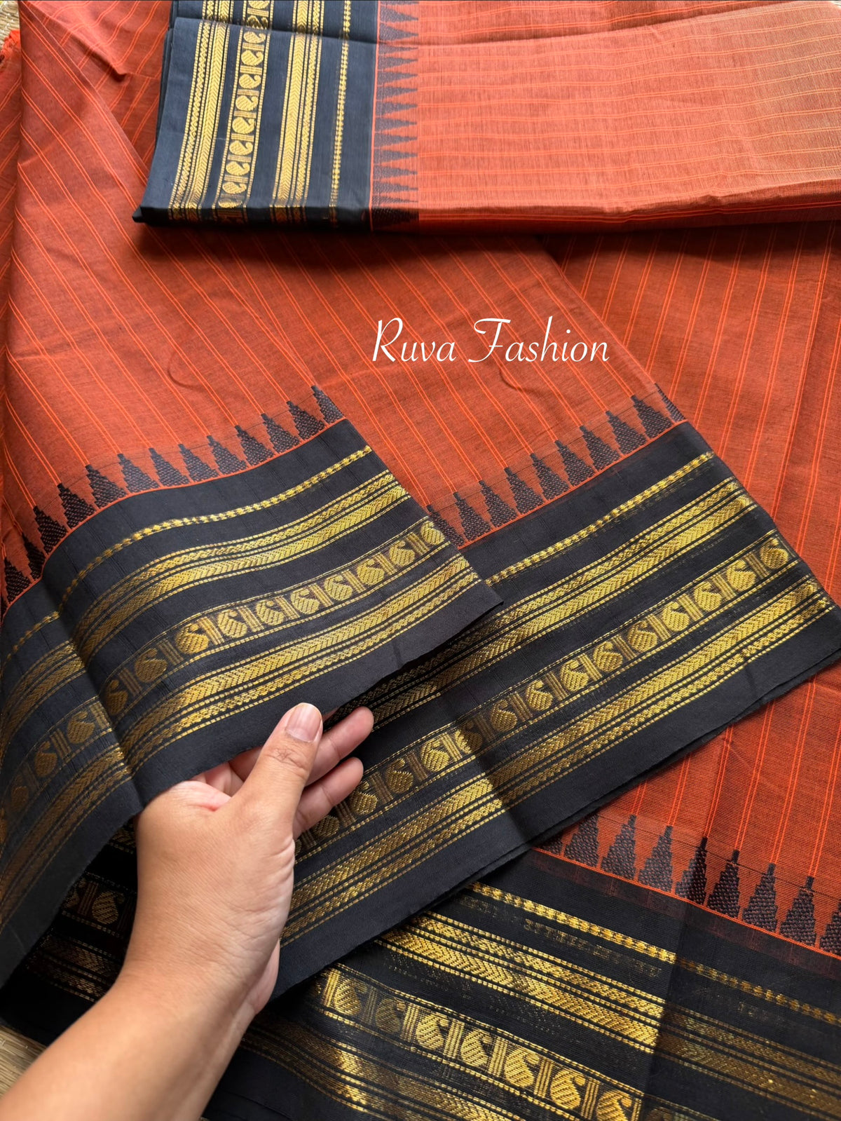 RF59 Rust Orange shade with contrast black Zari Border Kanchi cotton saree with striped pattern