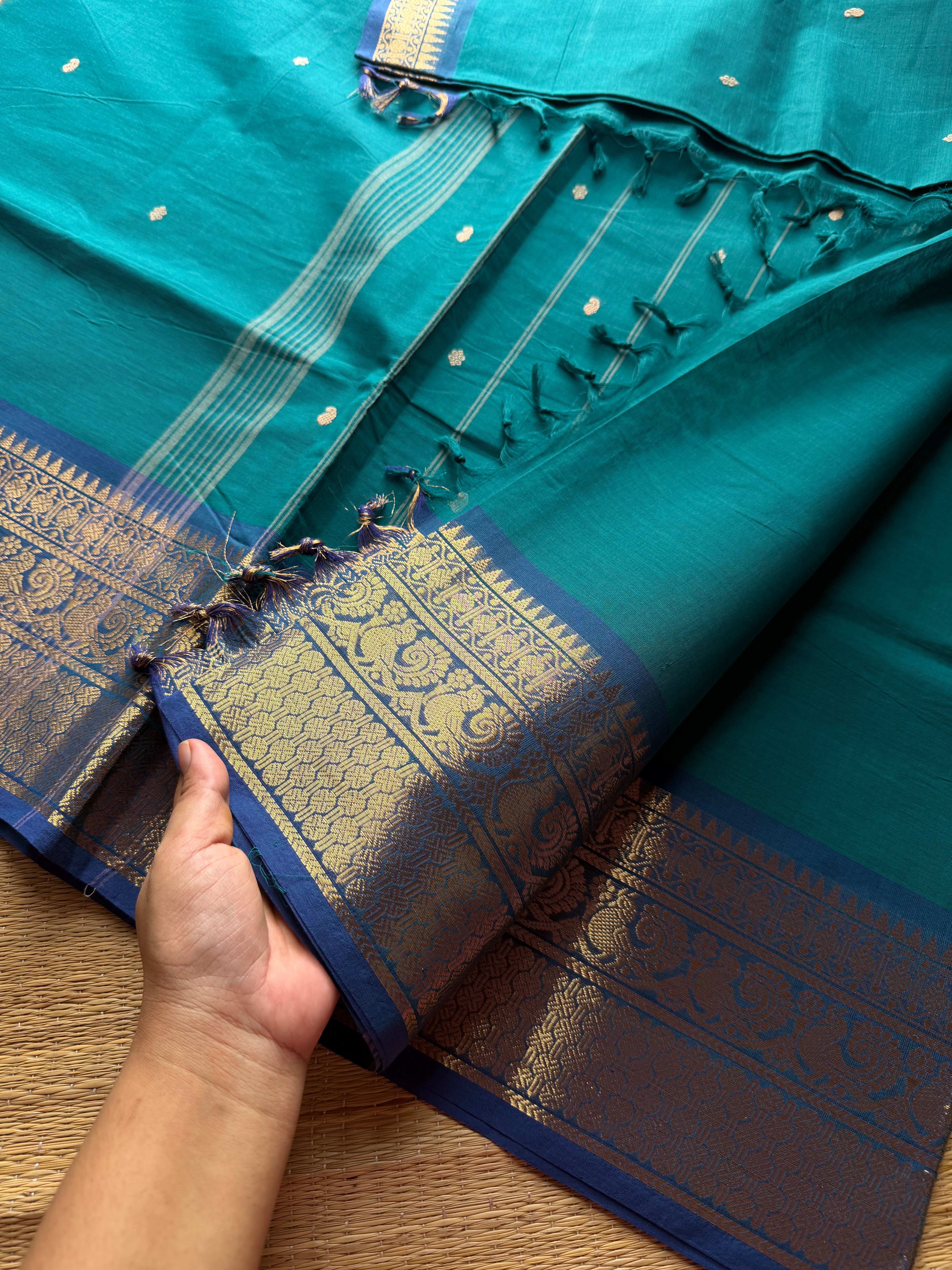 Dark teal blue Kanchi cotton saree with contrast royal blue border Annam pattern with handmade thread buttas