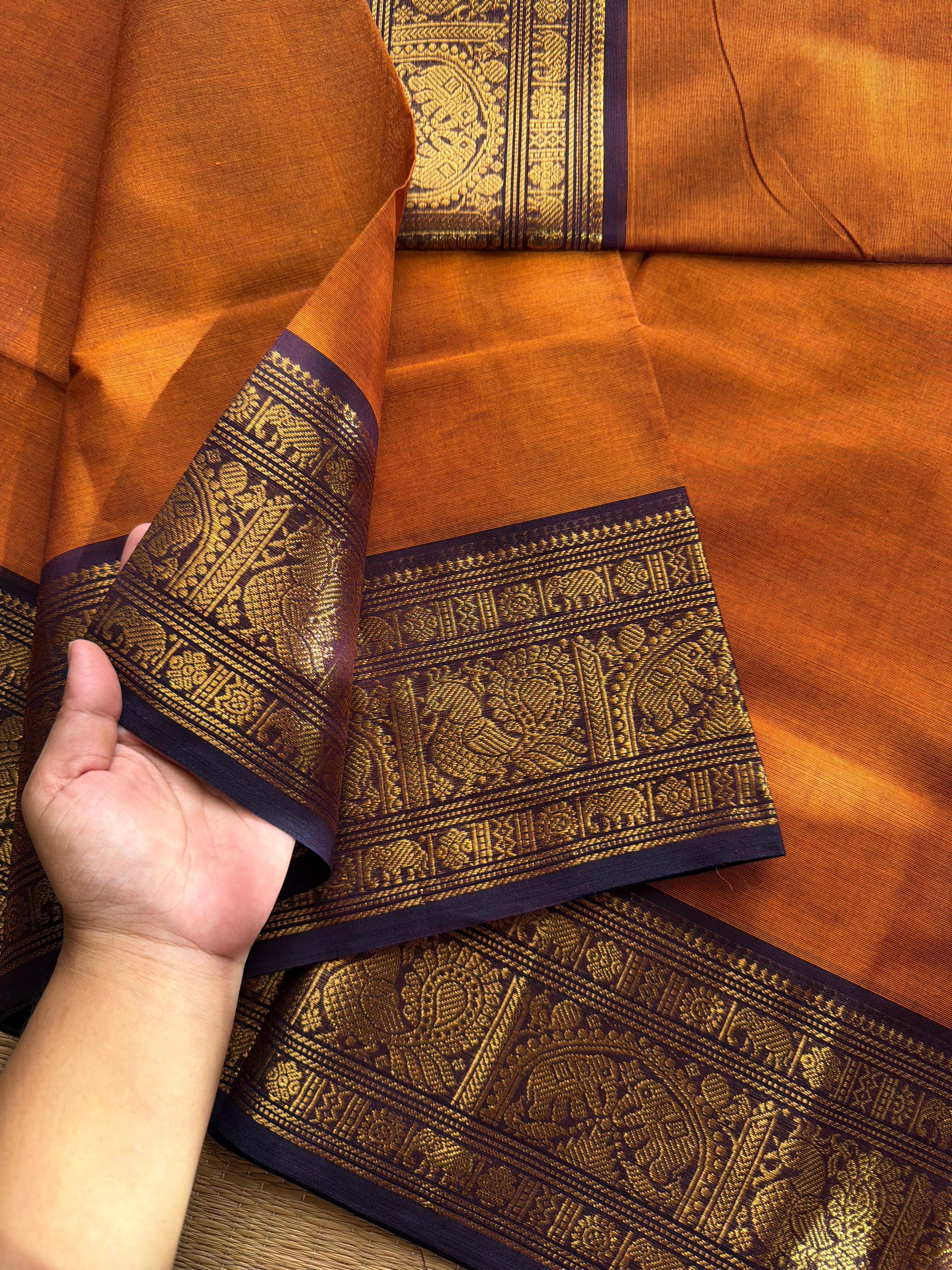 Rust orange shade Kanchi cotton saree with silk saree inspired Annam and elephant pattern border