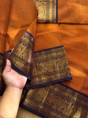 Rust orange shade Kanchi cotton saree with silk saree inspired Annam and elephant pattern border