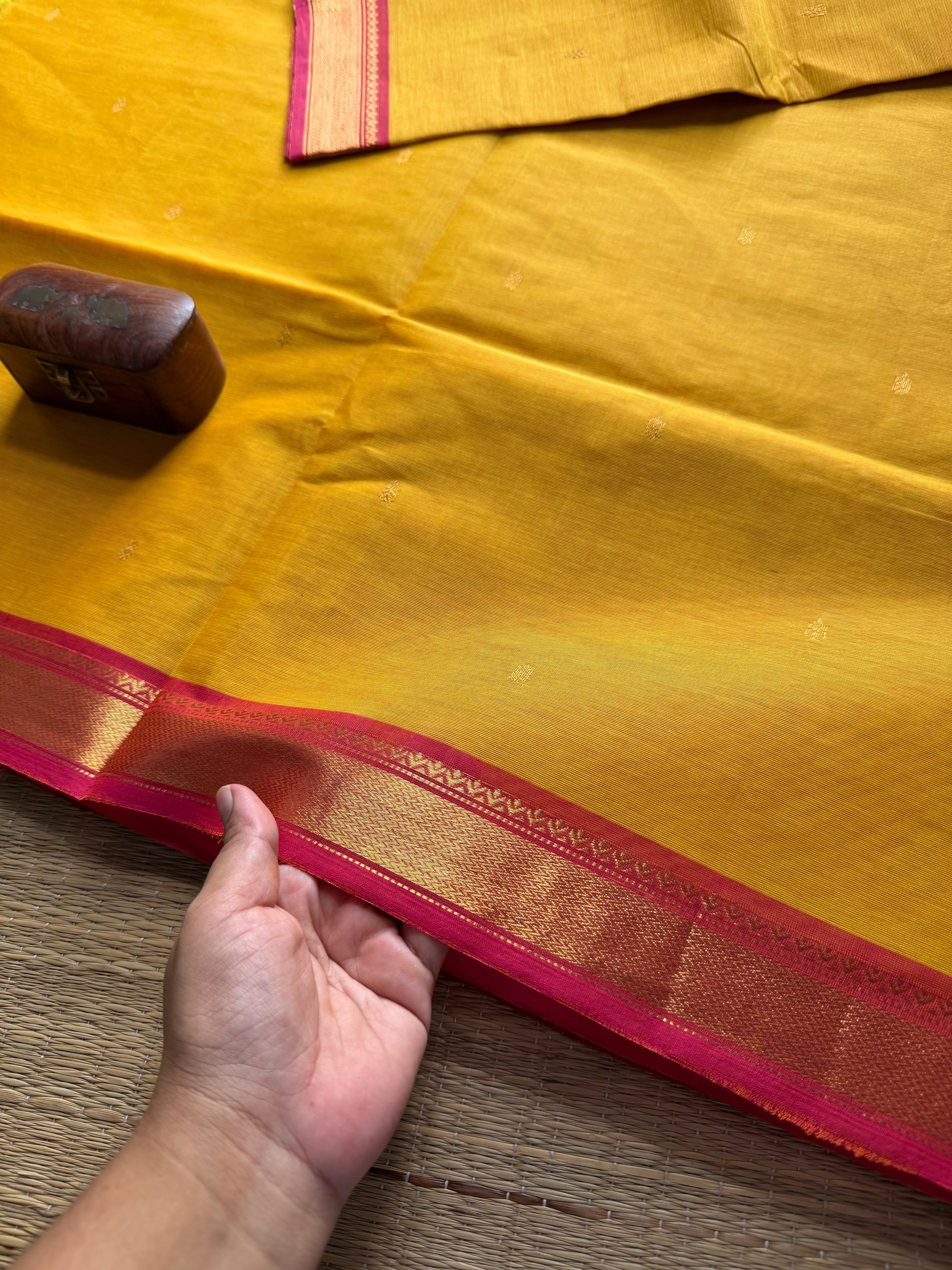 Mustard yellow with pinkish peach combination small border Kanchi cotton saree with handmade golden Zari Buttas