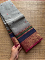 Dual tone grey shade Kanchi cotton saree with multi color contrast border and handmade thread buttas