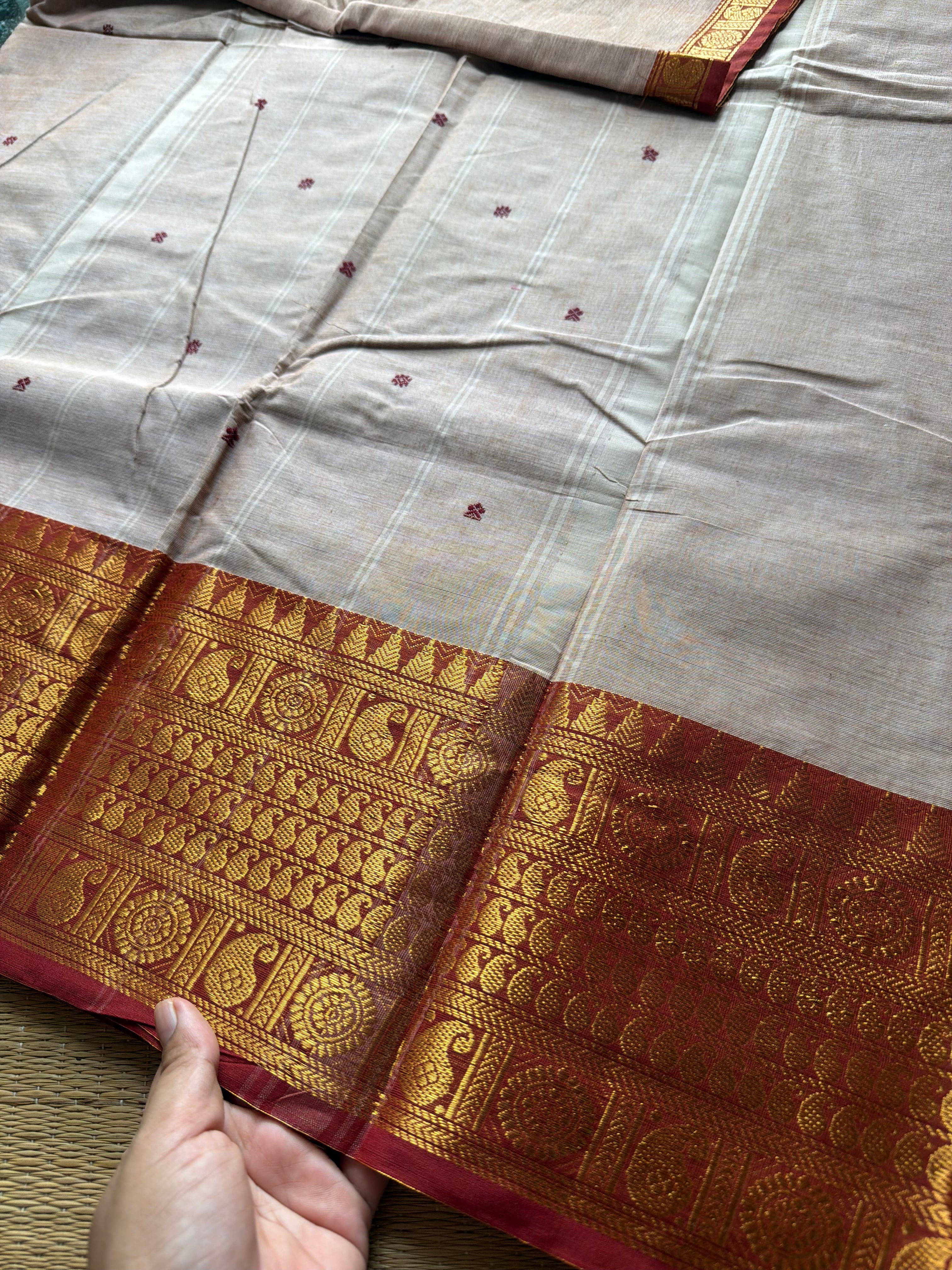 Beige with rust orange combination Kanchi cotton saree with handmade thread buttas