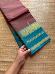 Unique and dual shade Kanchi cotton saree with contrast sky blue border and handmade golden Zari Buttas