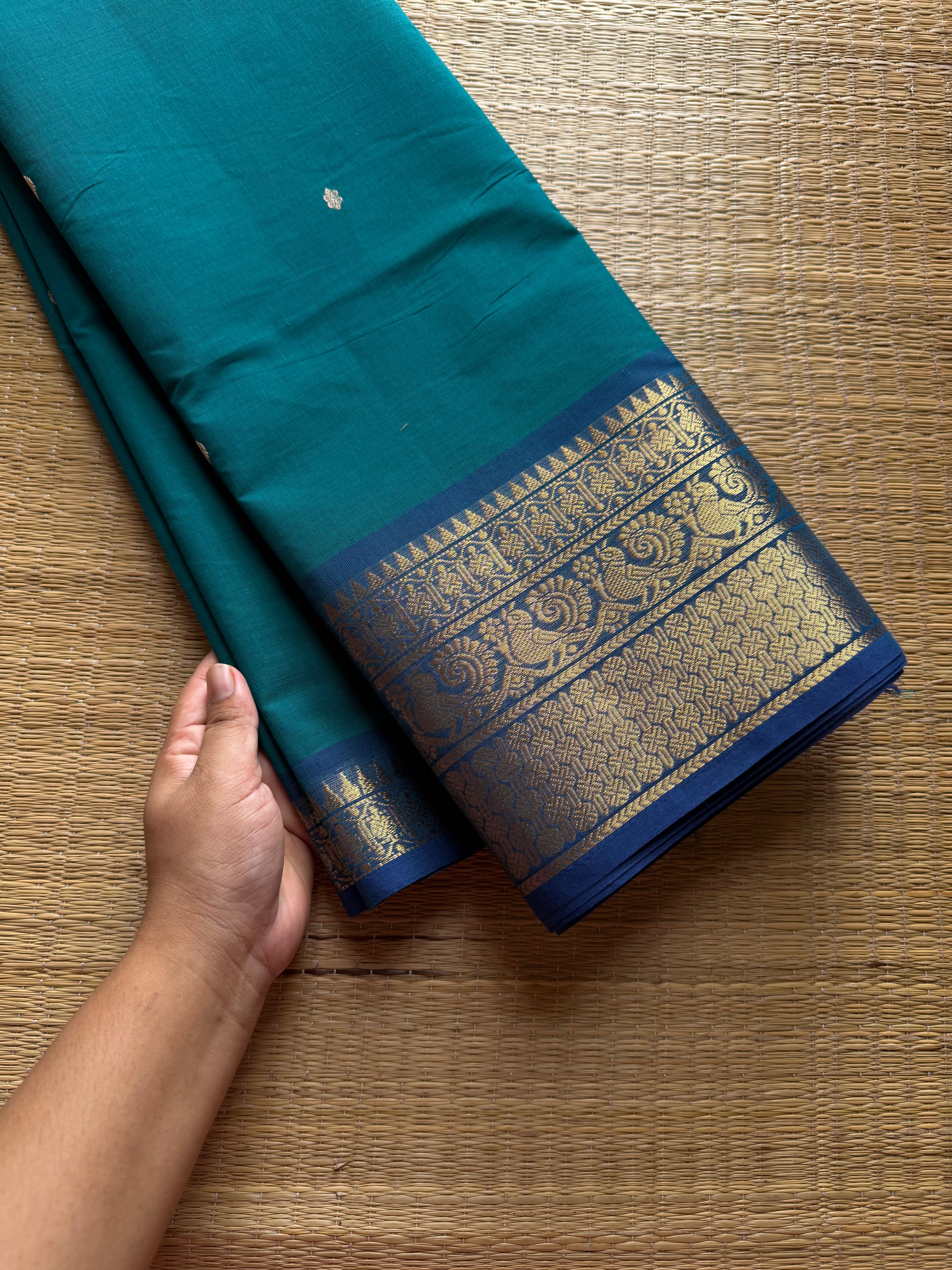 Dark teal blue Kanchi cotton saree with contrast royal blue border Annam pattern with handmade thread buttas