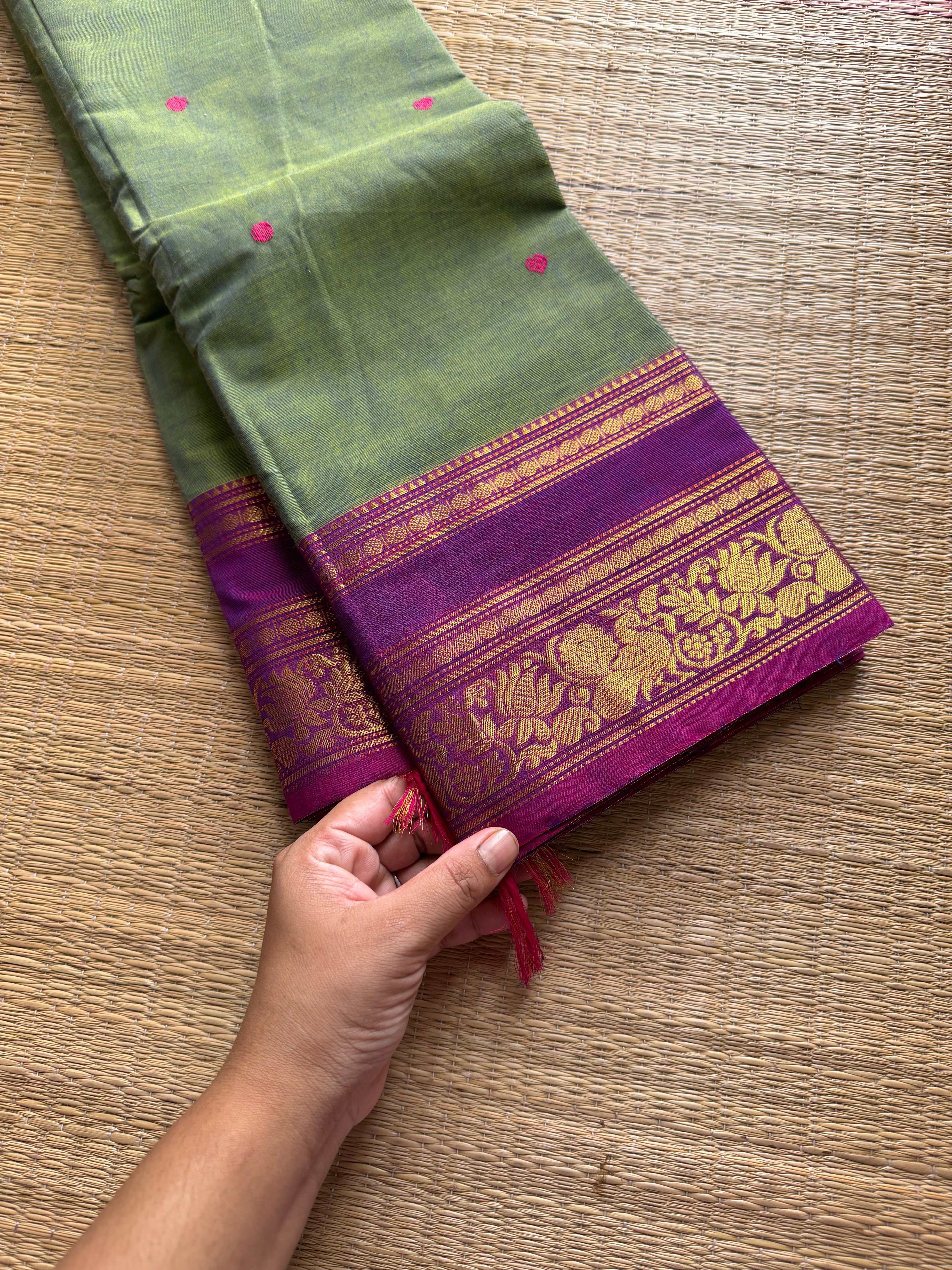 Dual tone green shade Kanchi cotton saree with contrast floral pattern border and handmade thread buttas