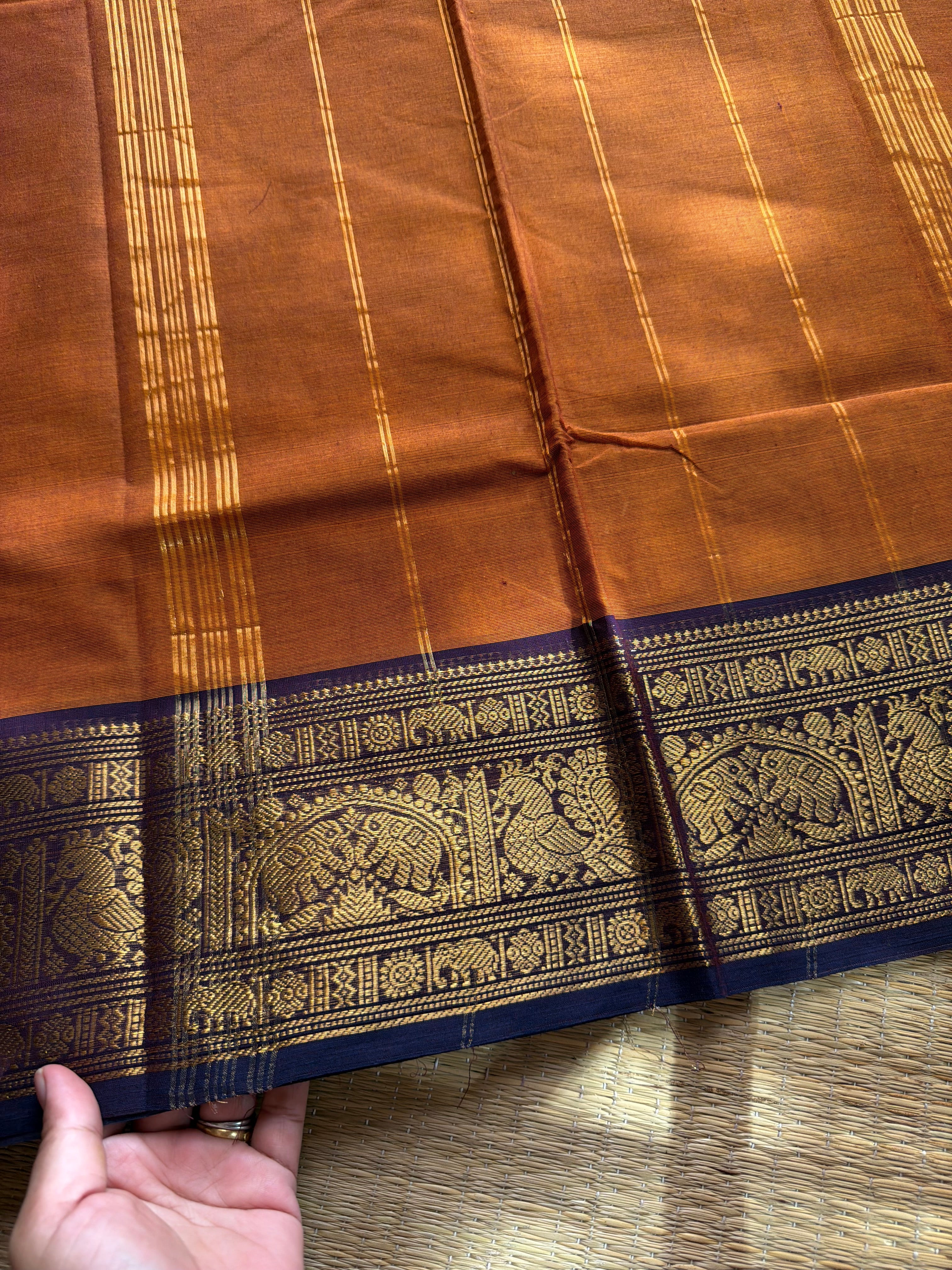Rust orange shade Kanchi cotton saree with silk saree inspired Annam and elephant pattern border