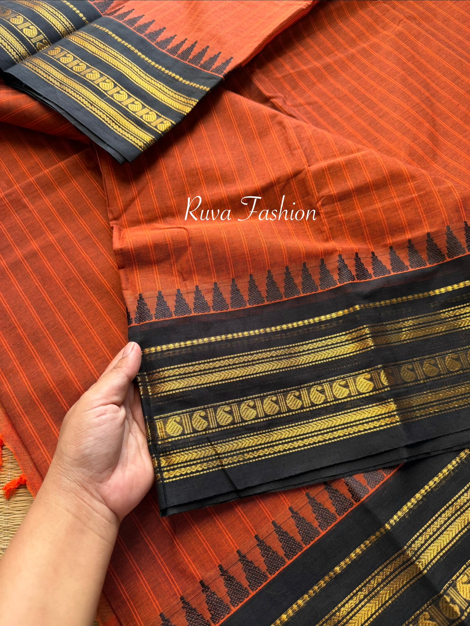 RF59 Rust Orange shade with contrast black Zari Border Kanchi cotton saree with striped pattern