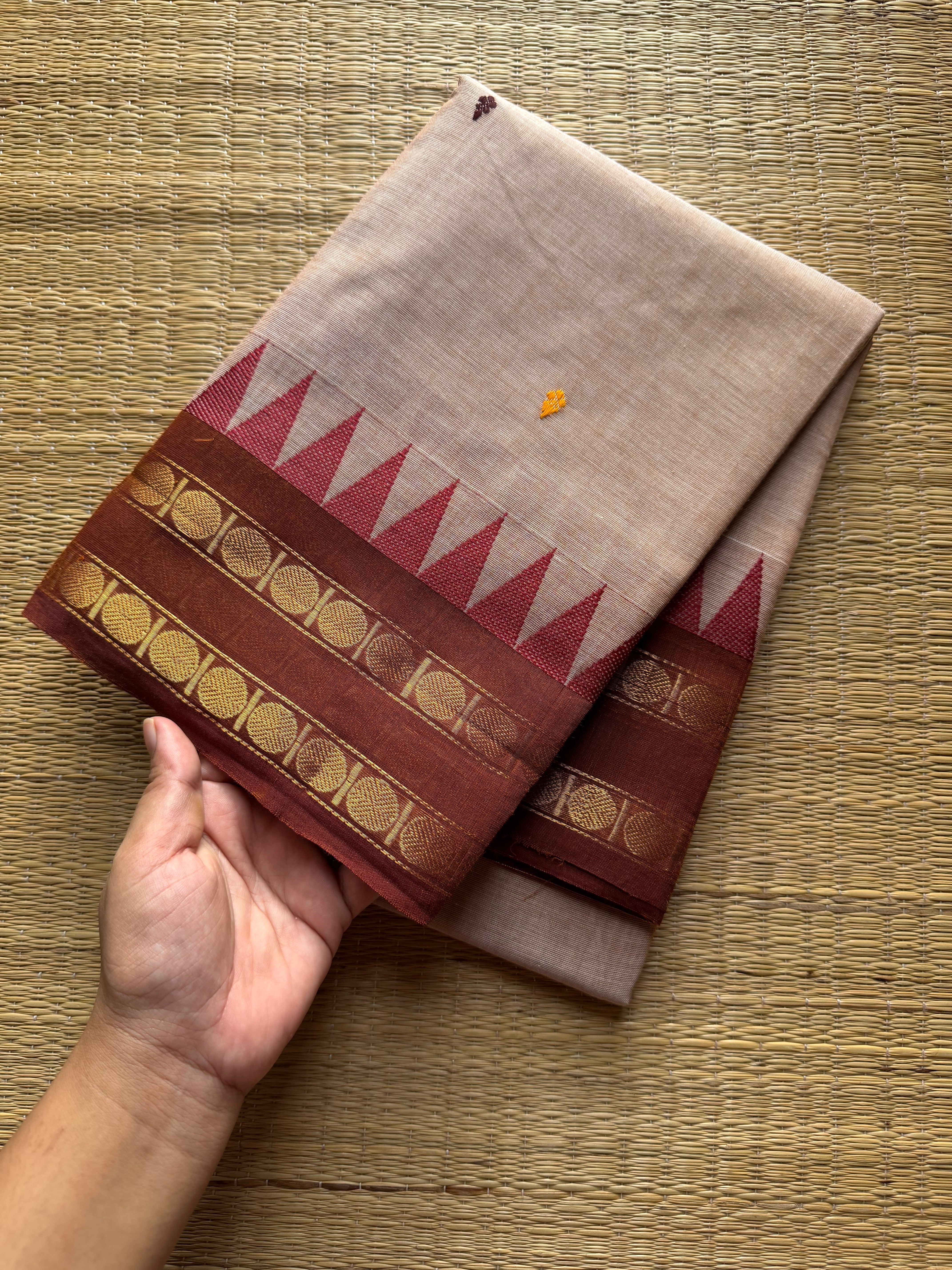 Beige shade Kanchi cotton saree with handmade thread buttas