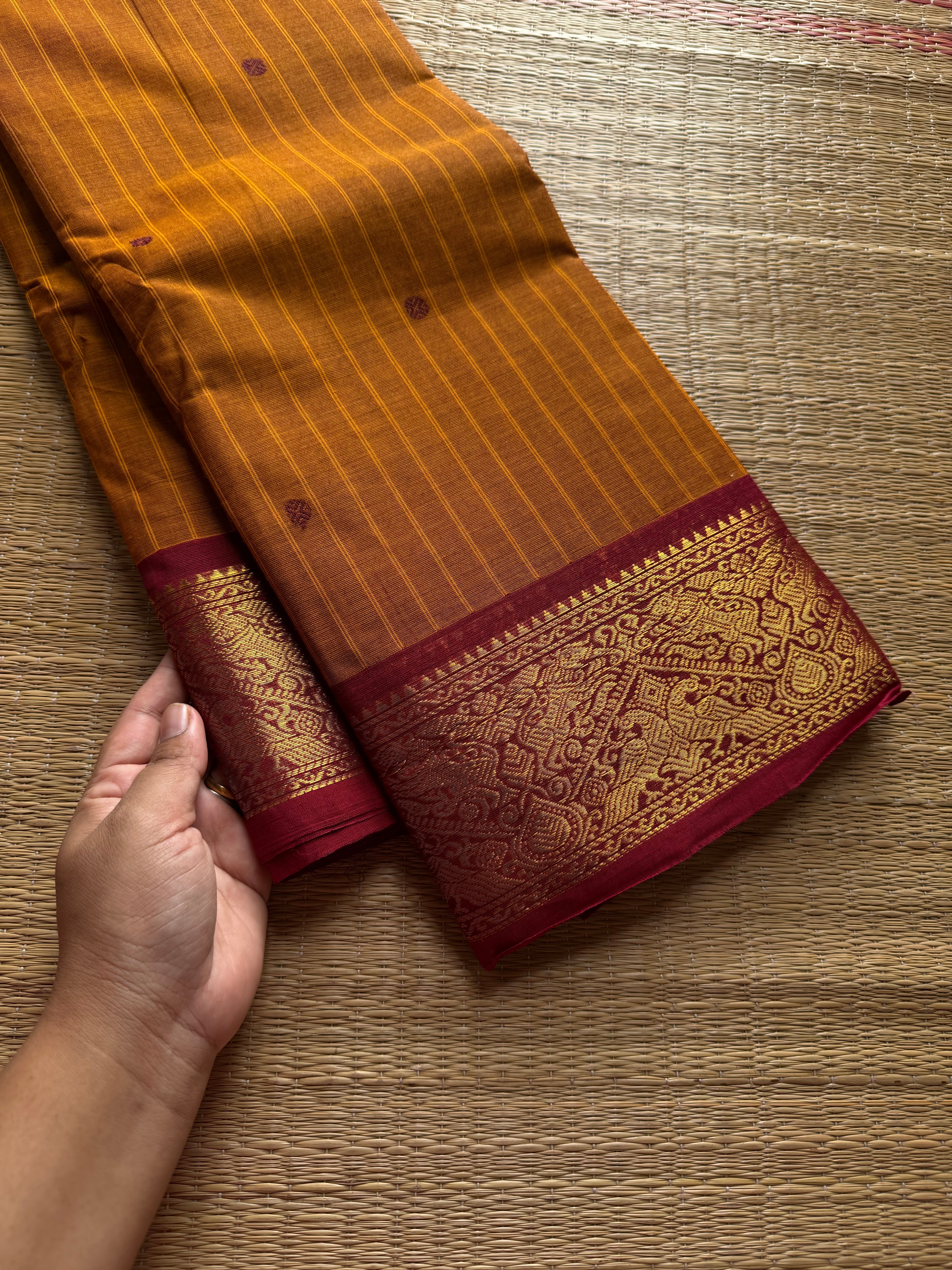 RF536 Dual tone orange with contrast maroon combination Kanchi cotton saree with Vanasingaram border and handmade thread buttas