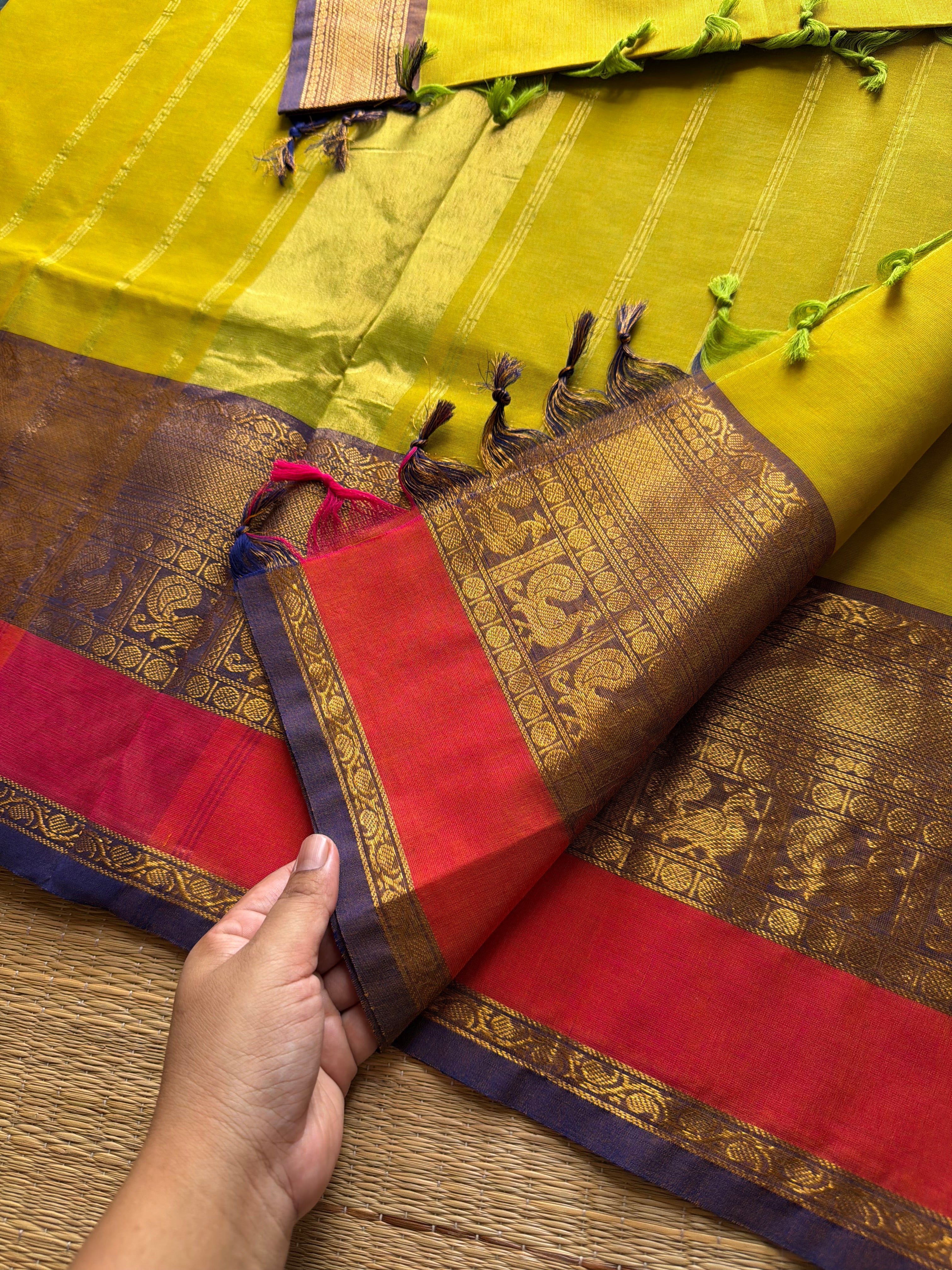 Lemon Yellow shade Kanchi cotton saree with contrast big Zari border