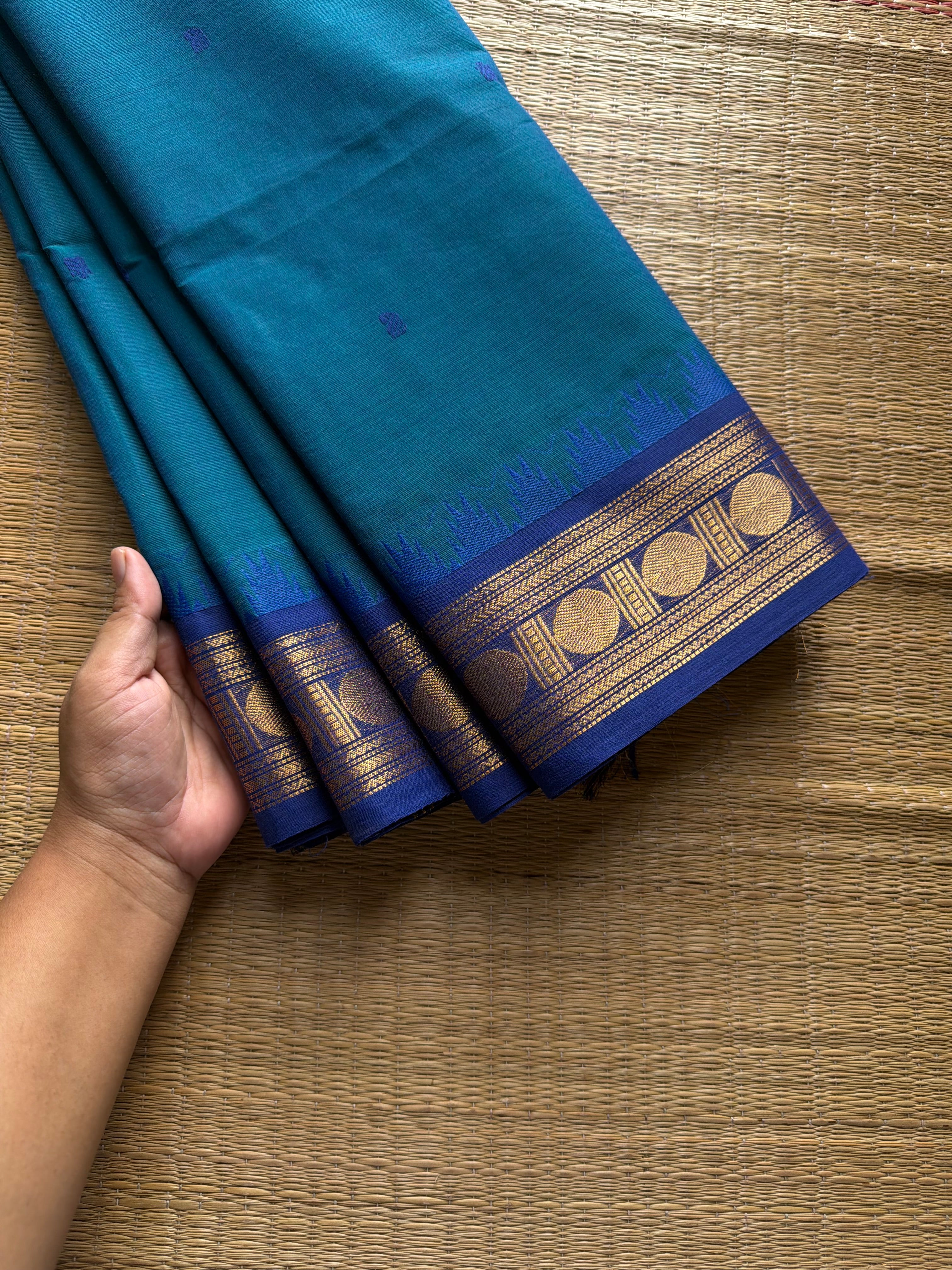 RF1022 Peacock blue shade Kanchi cotton saree with handmade thread buttas