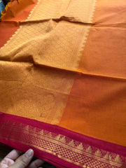 Orange shade with contrast small maroon zari small Thazhampoo border Kanchi cotton saree with rich Zari woven Pallu & hand made Zari Buttas