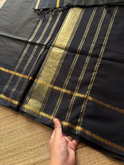 Monotone black shade Kanchi cotton saree with vintage gap border and fully golden Vairaoosi pattern