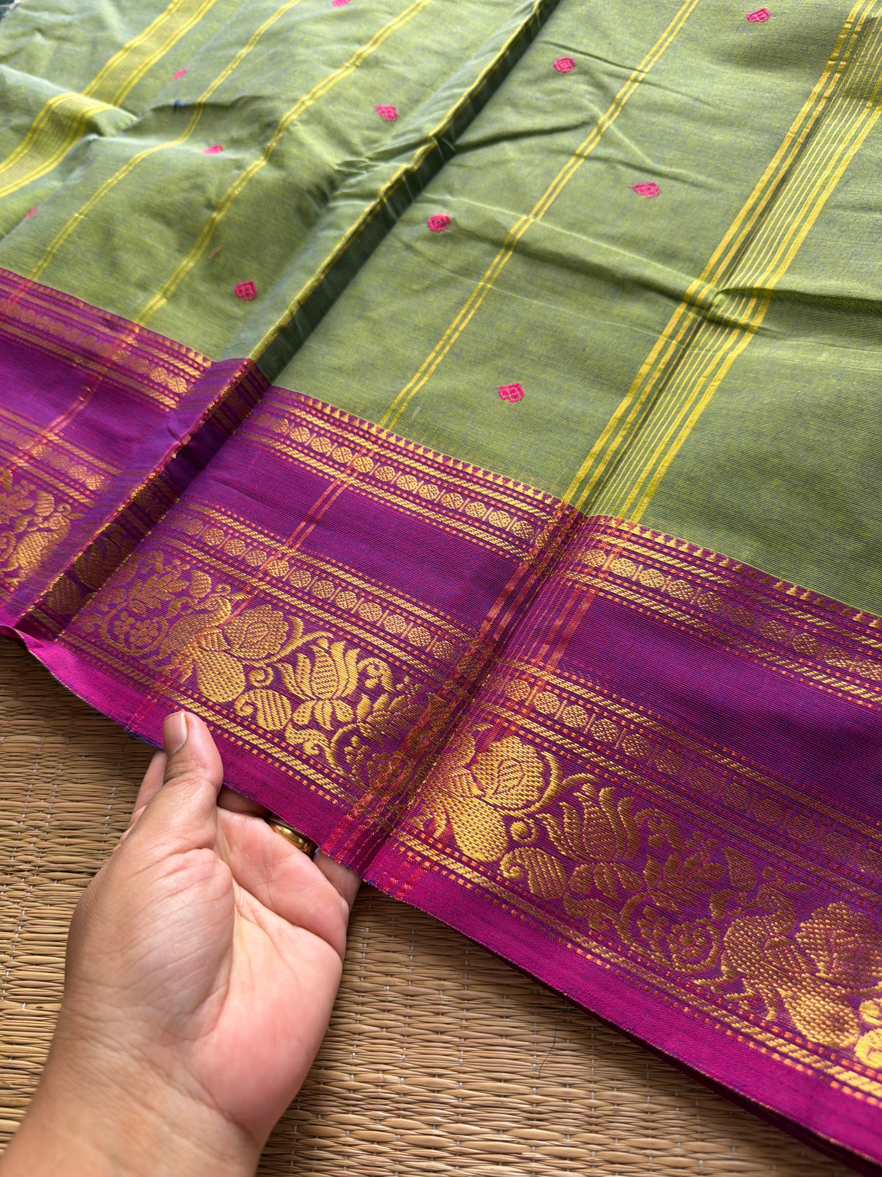 Dual tone green shade Kanchi cotton saree with contrast floral pattern border and handmade thread buttas