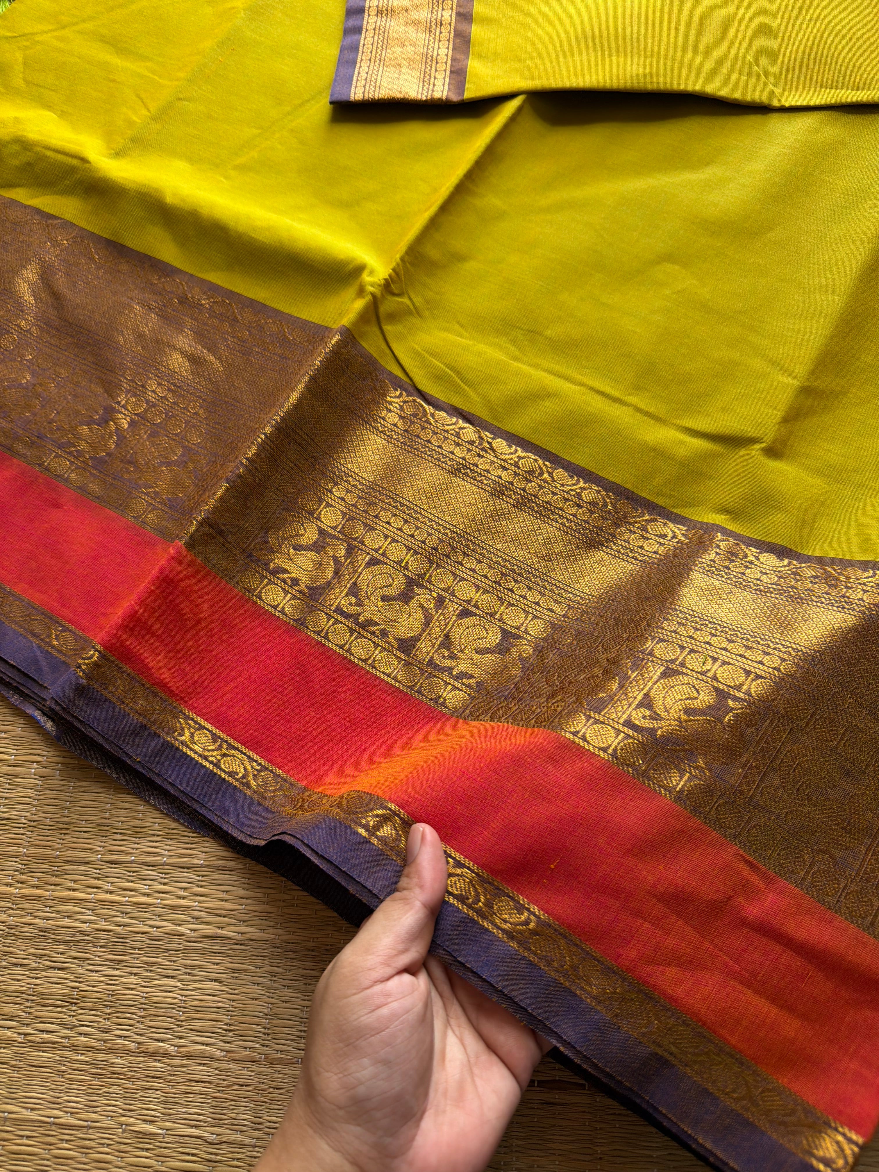 Lemon Yellow shade Kanchi cotton saree with contrast big Zari border
