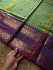 Apple green shade Kanchi cotton saree with handmade thread buttas