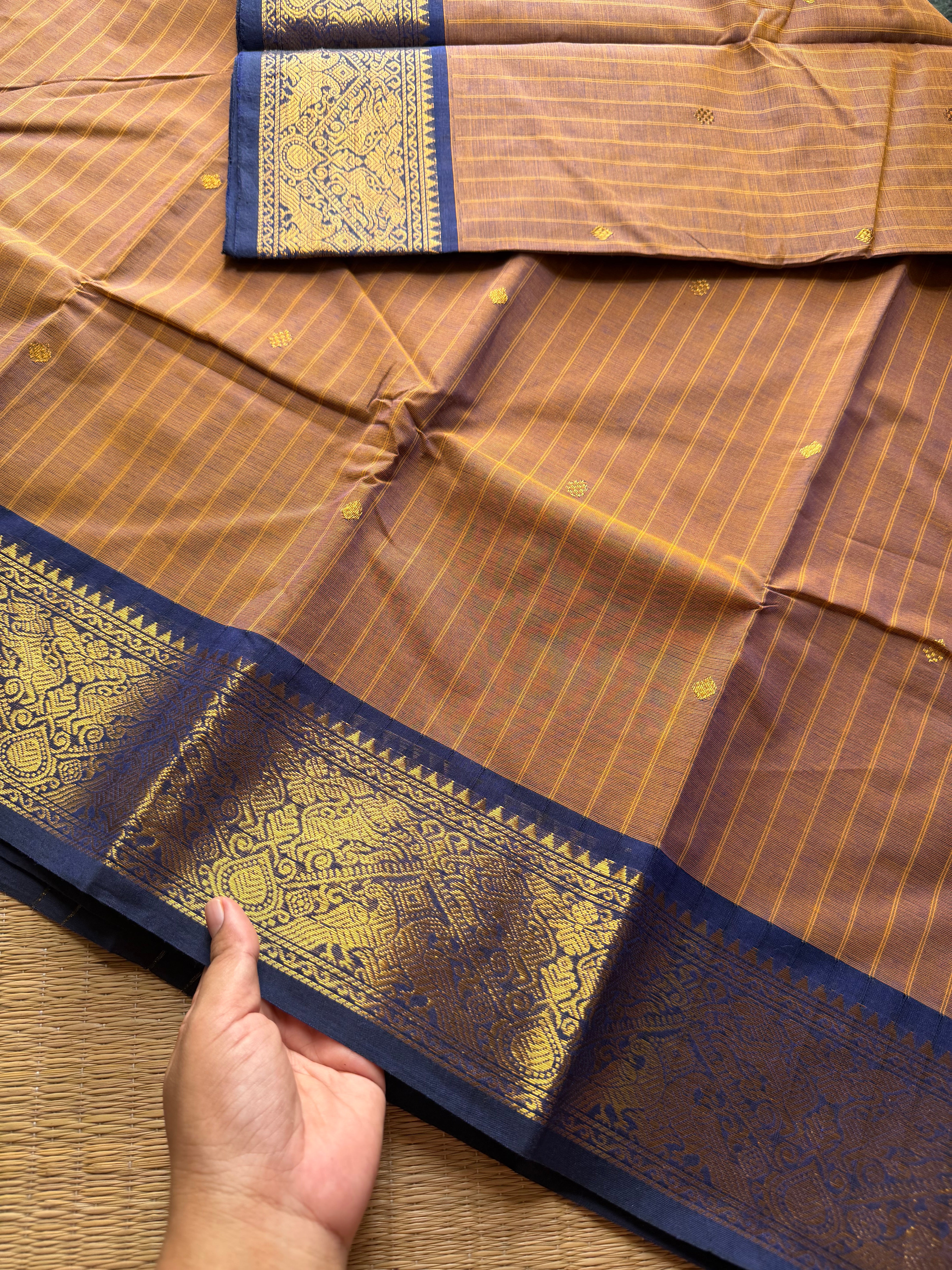 RF191 Dual tone mustard brown With contrast navy blue combination Vanasingaram border Kanchi cotton saree with striped pattern & handmade thread buttas