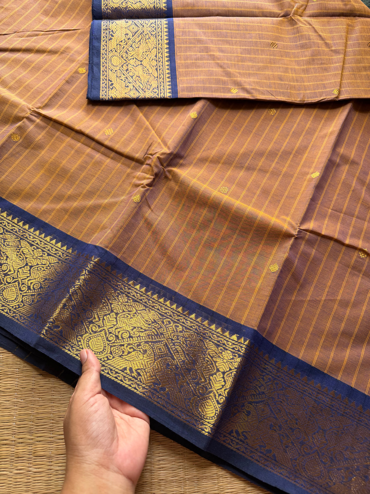 RF191 Dual tone mustard brown With contrast navy blue combination Vanasingaram border Kanchi cotton saree with striped pattern & handmade thread buttas