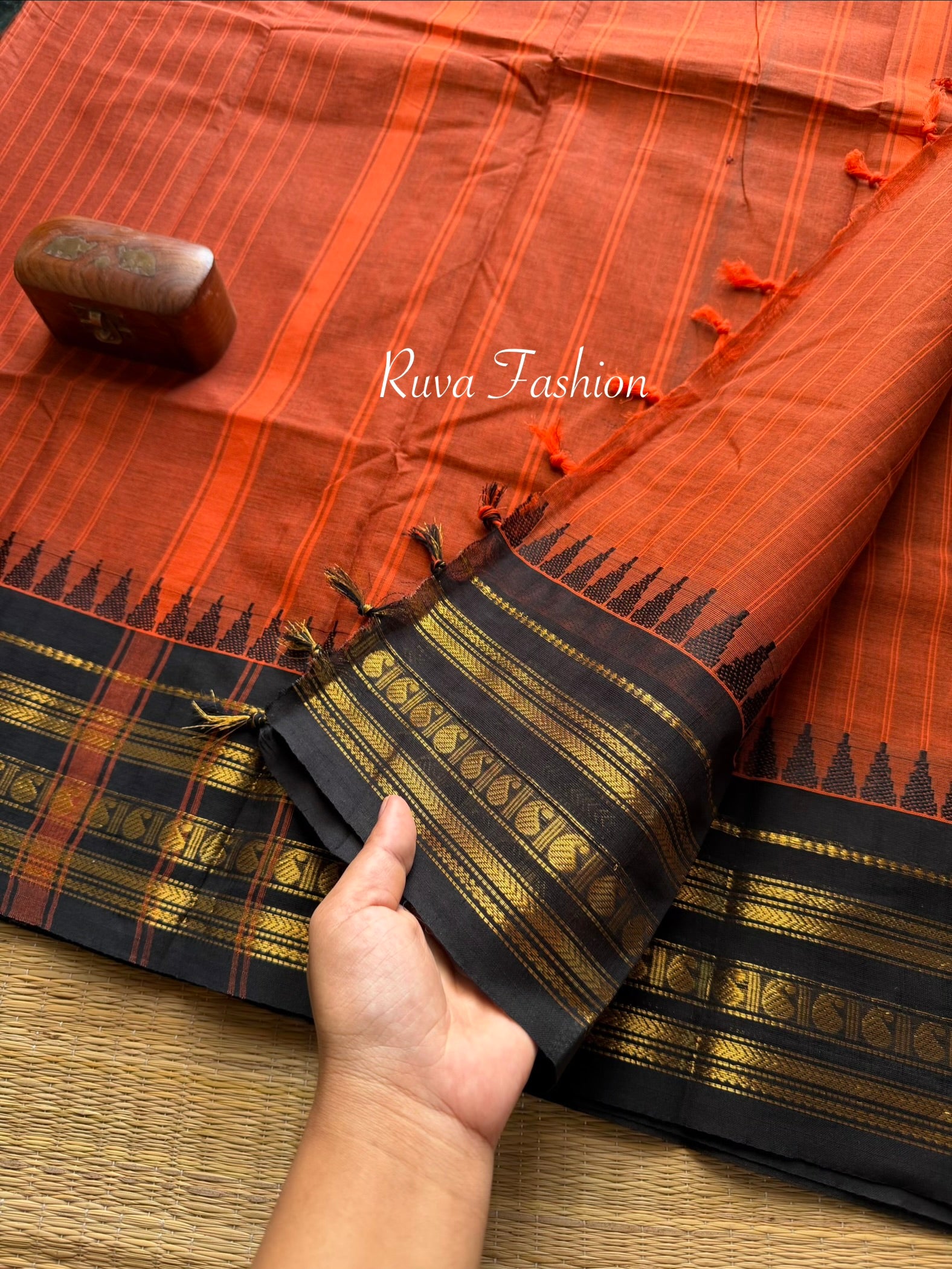 RF59 Rust Orange shade with contrast black Zari Border Kanchi cotton saree with striped pattern