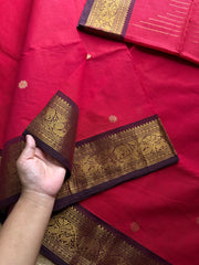 Premium Kanchi Cotton Saree : Reddish maroon with brown combination Kanchi Cotton Saree With Unique Vanasingaram Border and simple zari woven mango Motif Pallu