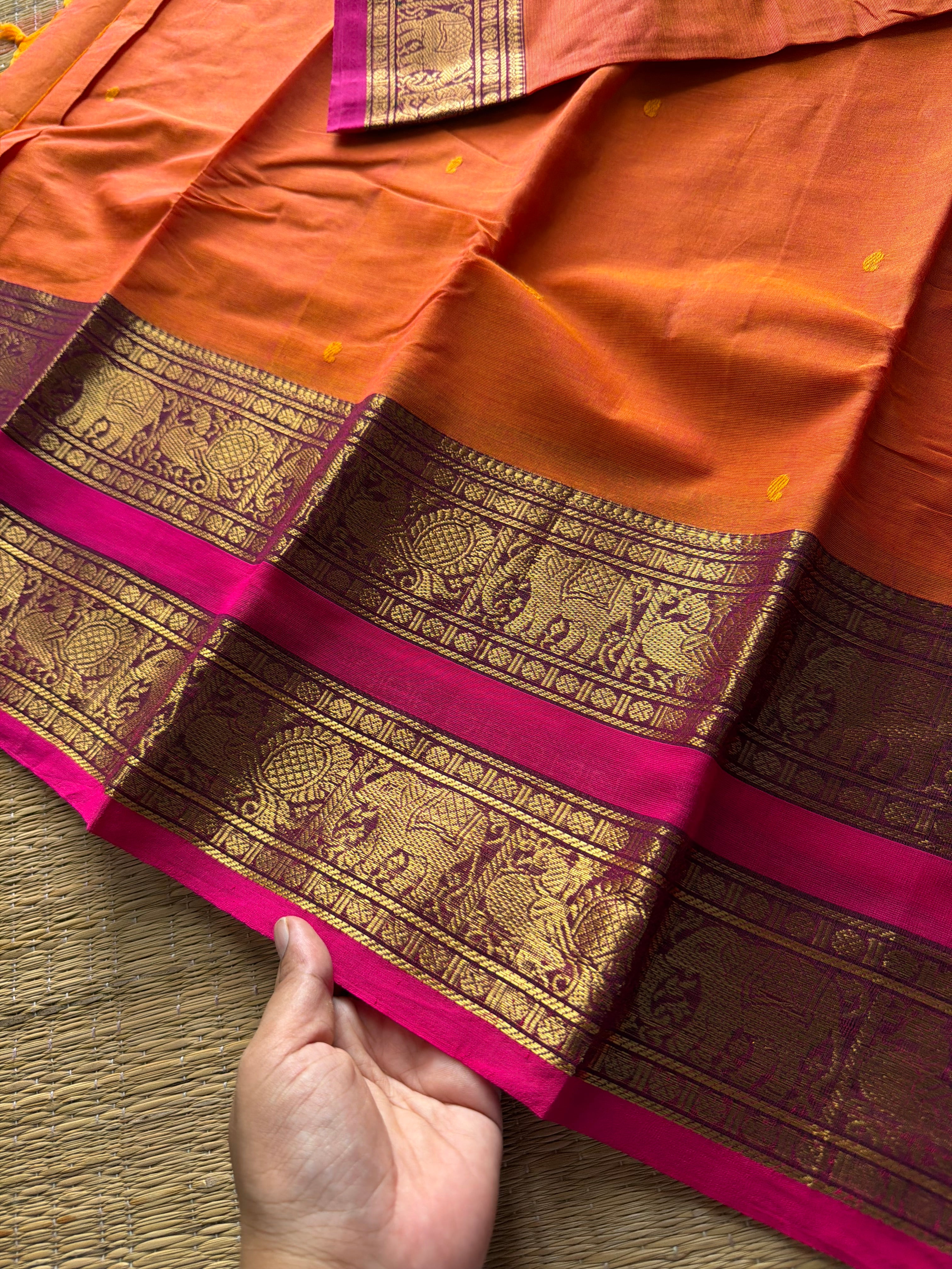 RF701 Orange shade Kanchi cotton saree with Rettapet border & handmade thread buttas