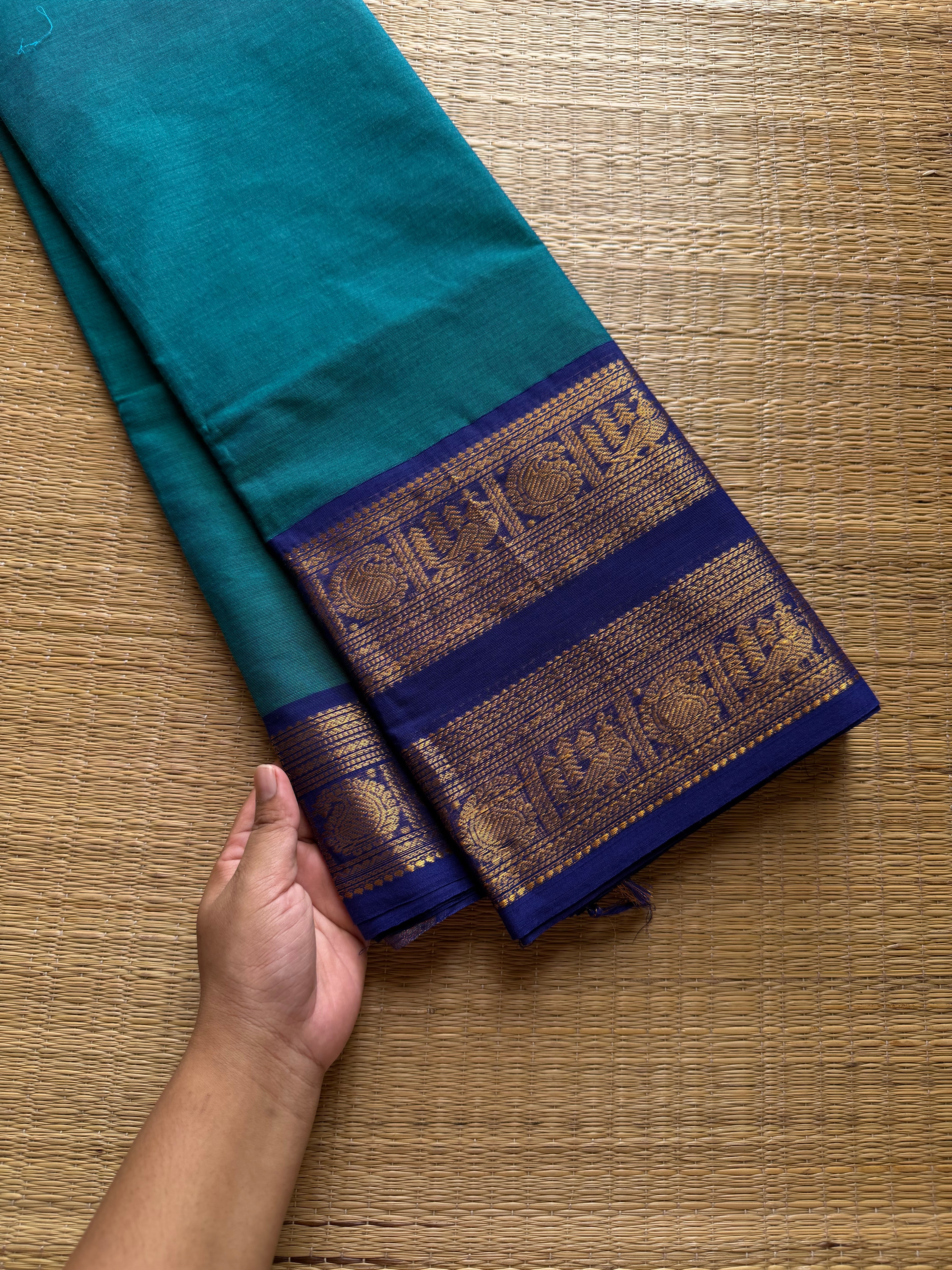 Peacock blue shade Kanchi cotton saree with Rettapet border