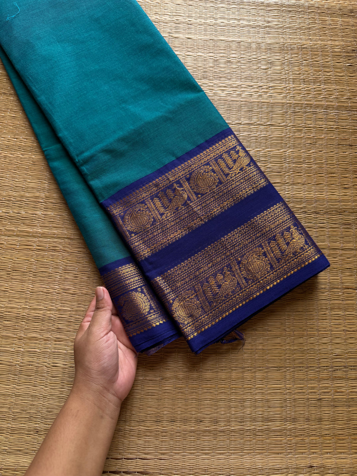 Peacock blue shade Kanchi cotton saree with Rettapet border