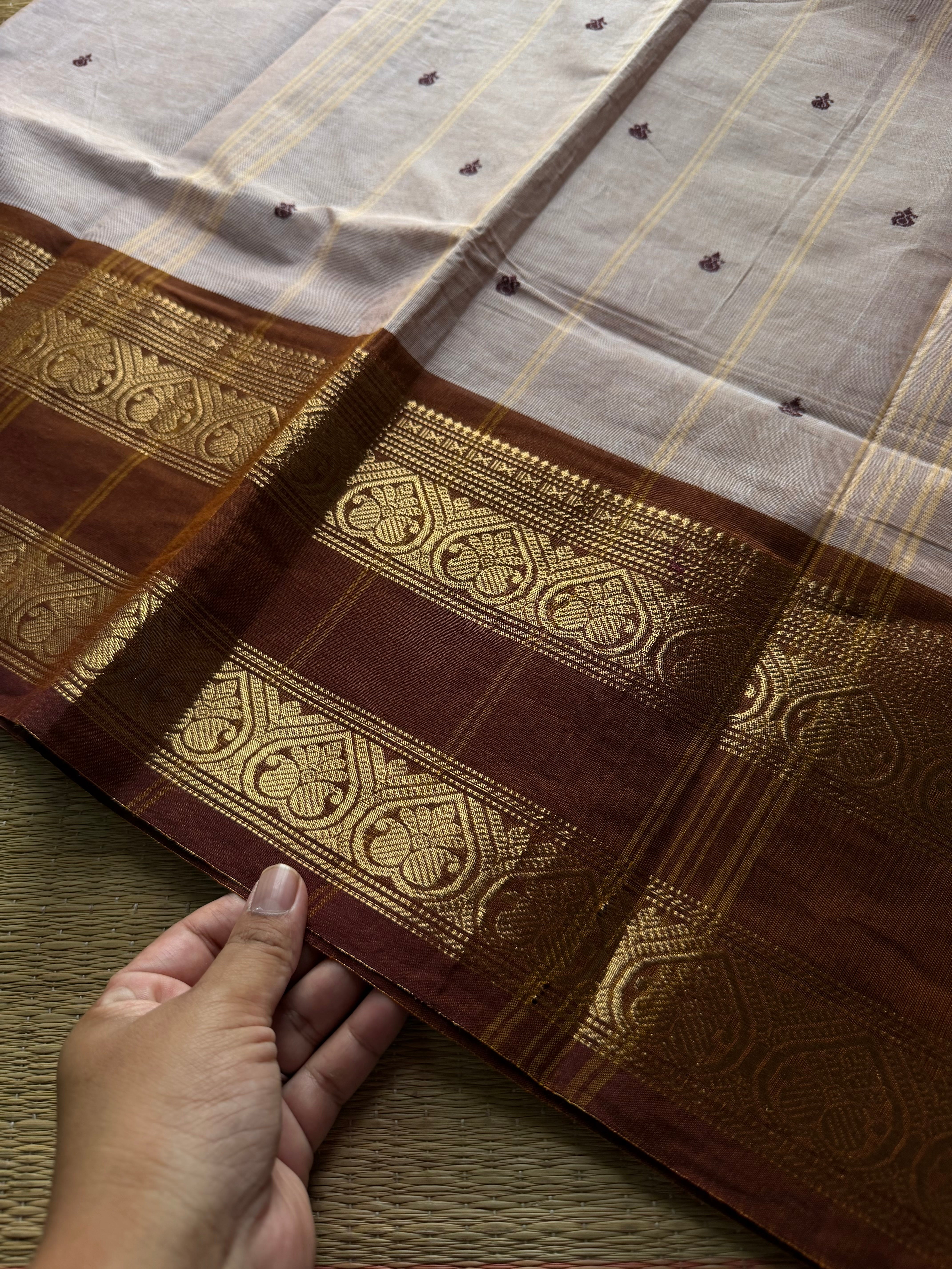Beige shade Kanchi cotton saree with handmade thread buttas