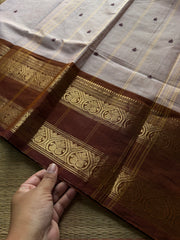 Beige shade Kanchi cotton saree with handmade thread buttas