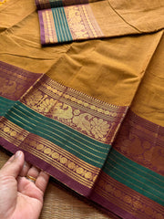 RF179 Mustard with contrast brown and green peacock pattern Kanchi cotton saree