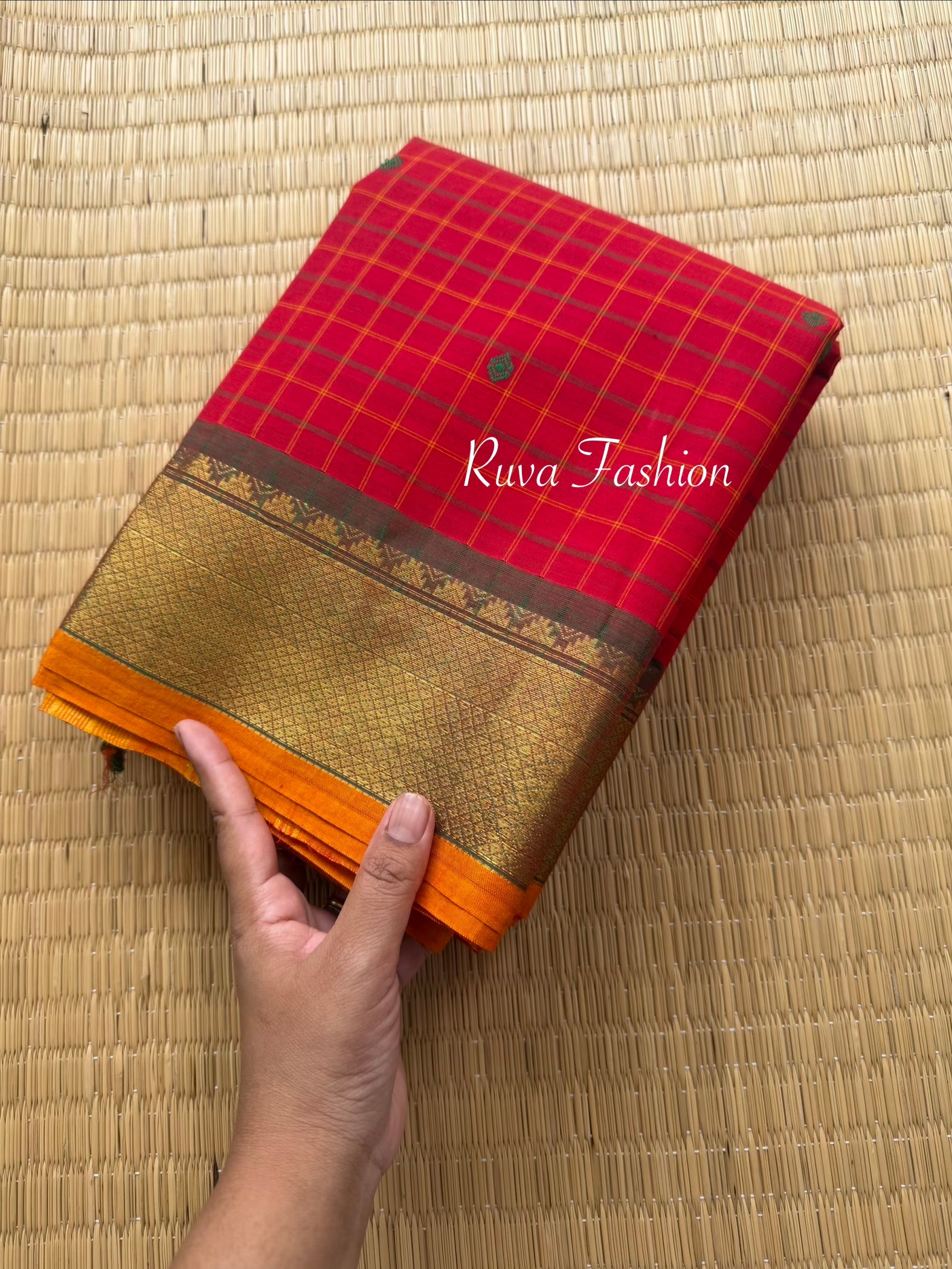 RF137 Chilli red Kanchi cotton saree featuring a classic checks (kattam) pattern, with elegant handmade thread buttas and contrast Zari border with small Thazhampoo pattern