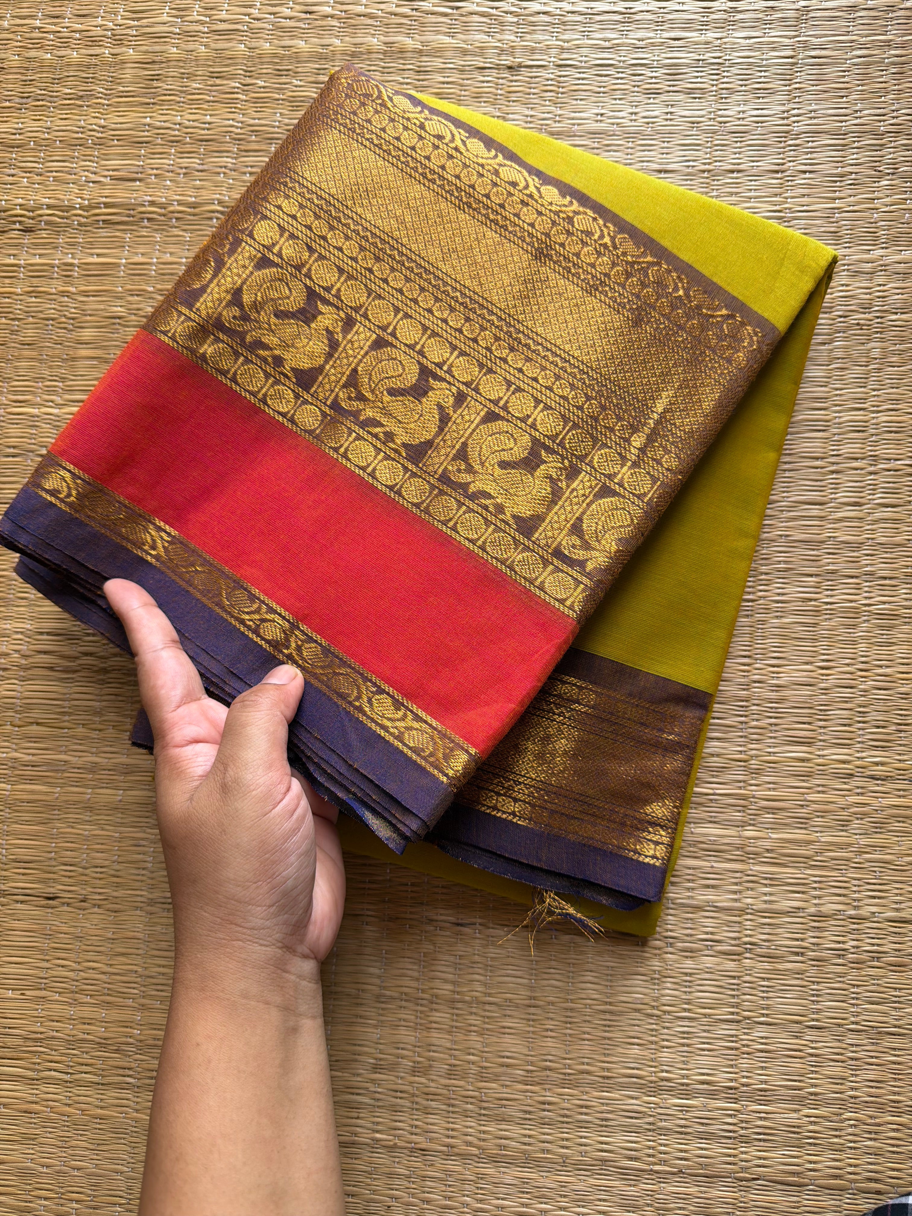 Lemon Yellow shade Kanchi cotton saree with contrast big Zari border