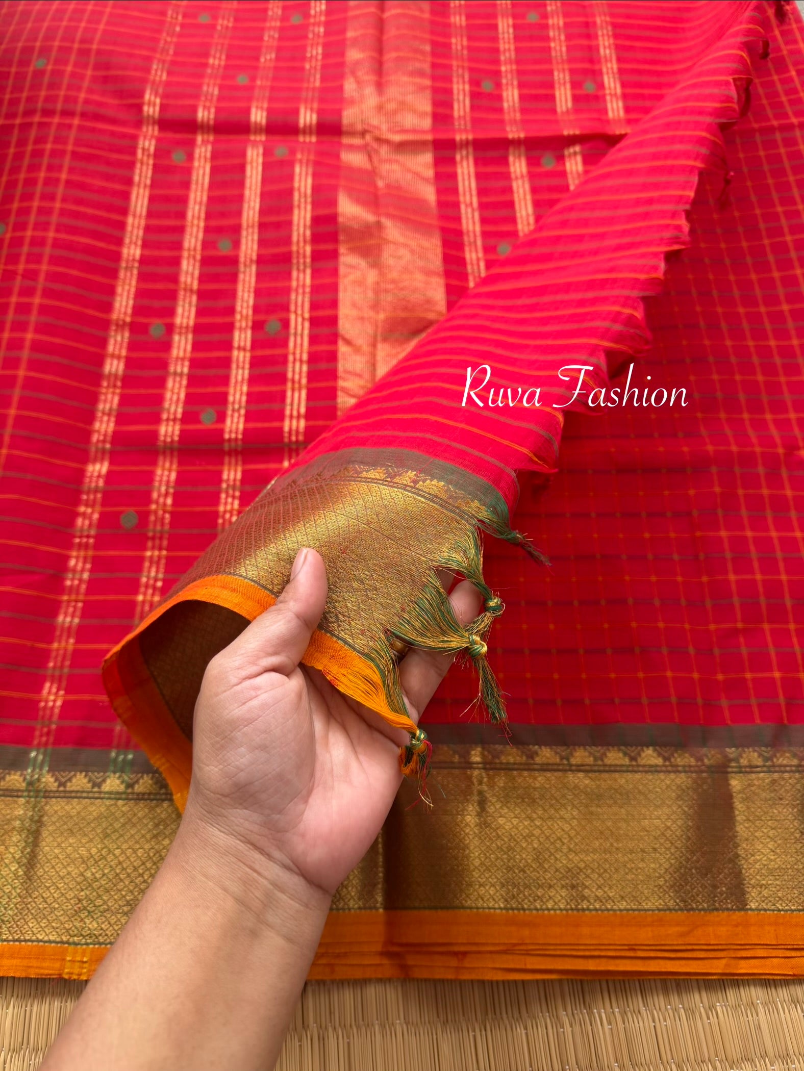 RF137 Chilli red Kanchi cotton saree featuring a classic checks (kattam) pattern, with elegant handmade thread buttas and contrast Zari border with small Thazhampoo pattern