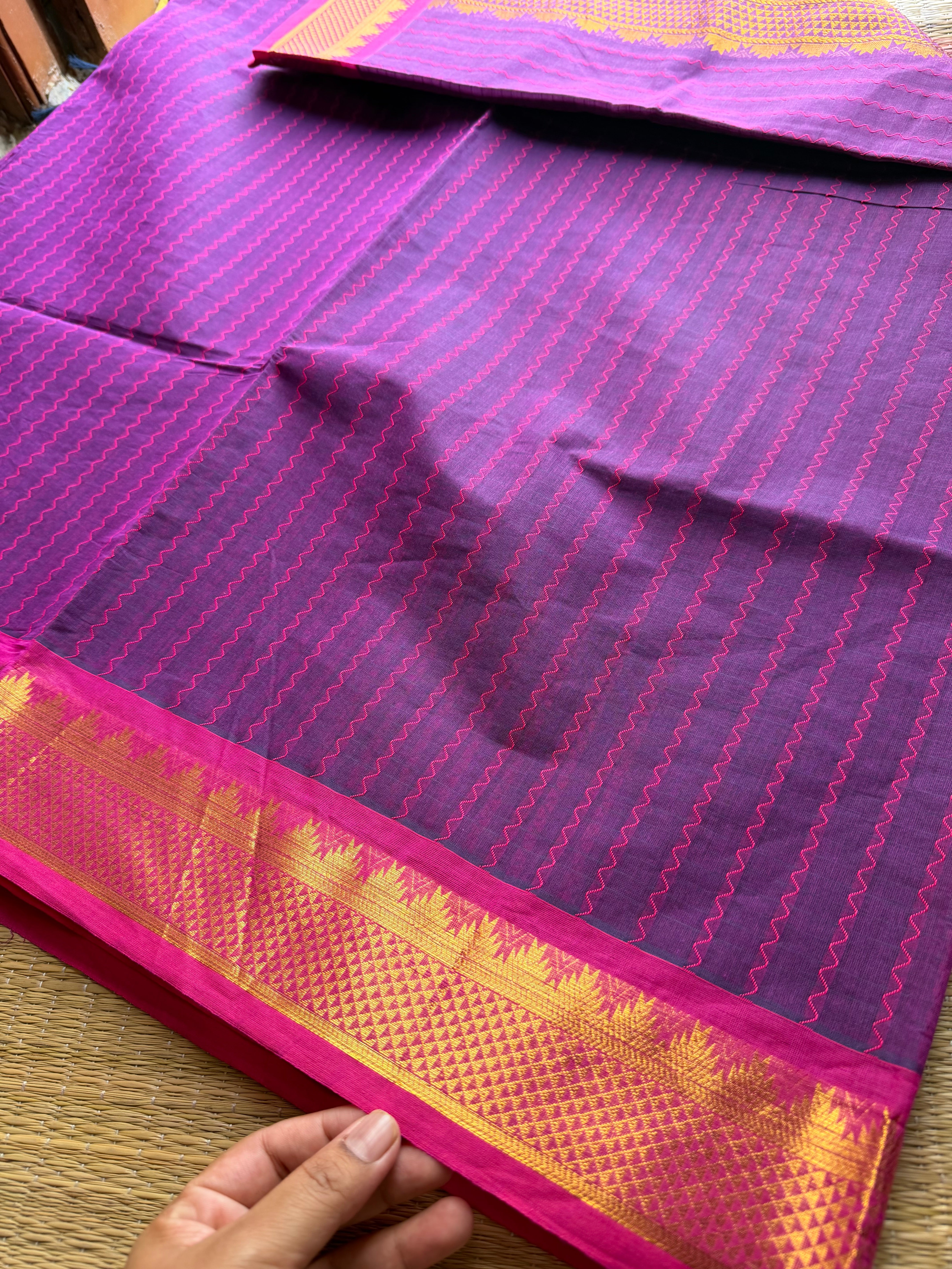 Purple shade with contrast small pink zari small Thazhampoo border Kanchi cotton saree with rich Zari woven Pallu & hand made Zari Buttas