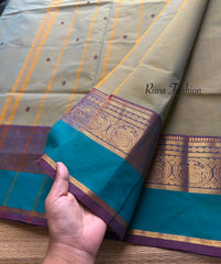 Dual shade of light dusty olive shade Kanchi cotton saree with contrast border and handmade thread buttas