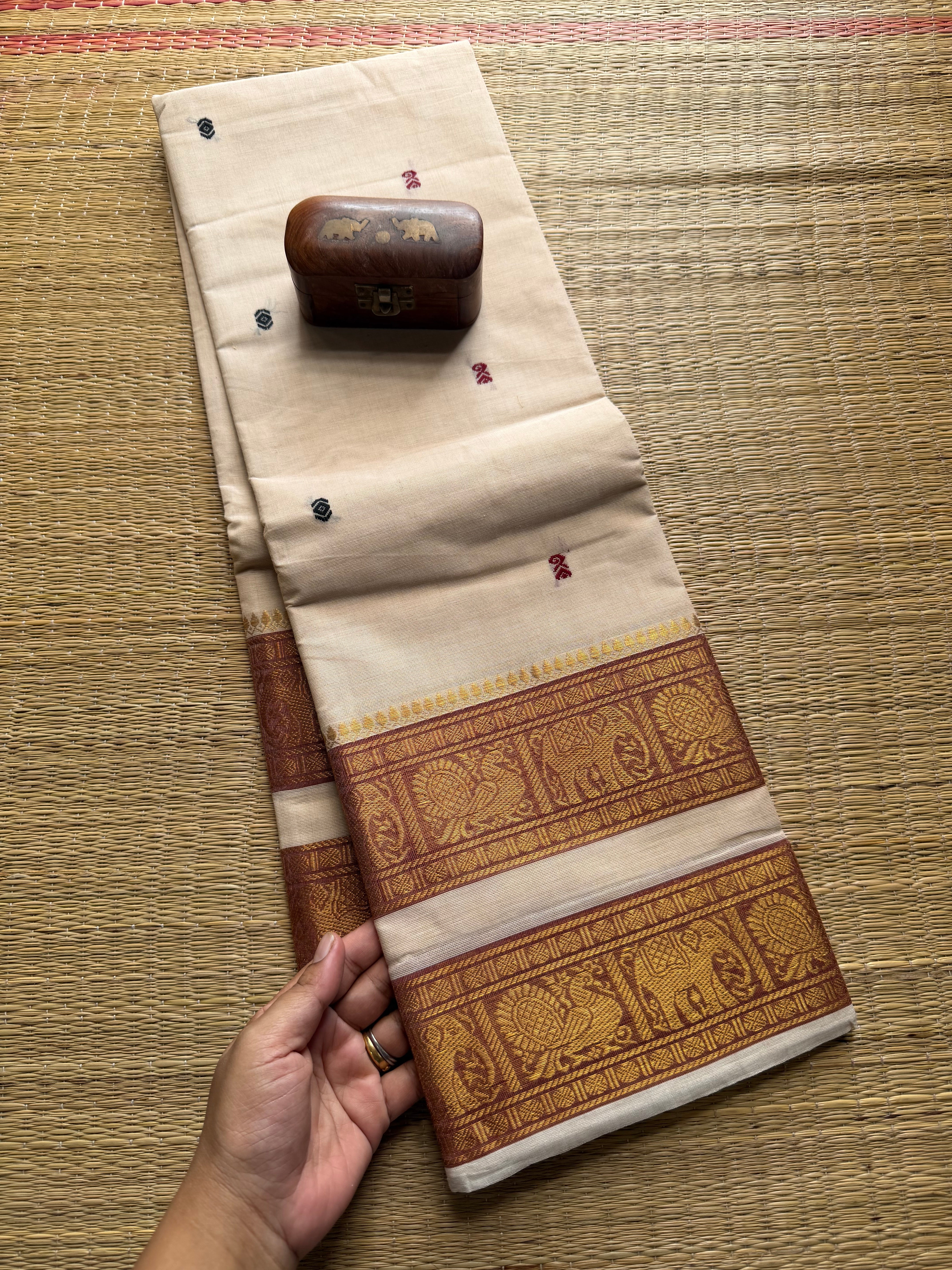 Half White Shade Kanchi Cotton Saree With Retta Patta Border And Handmade Thread Buttas