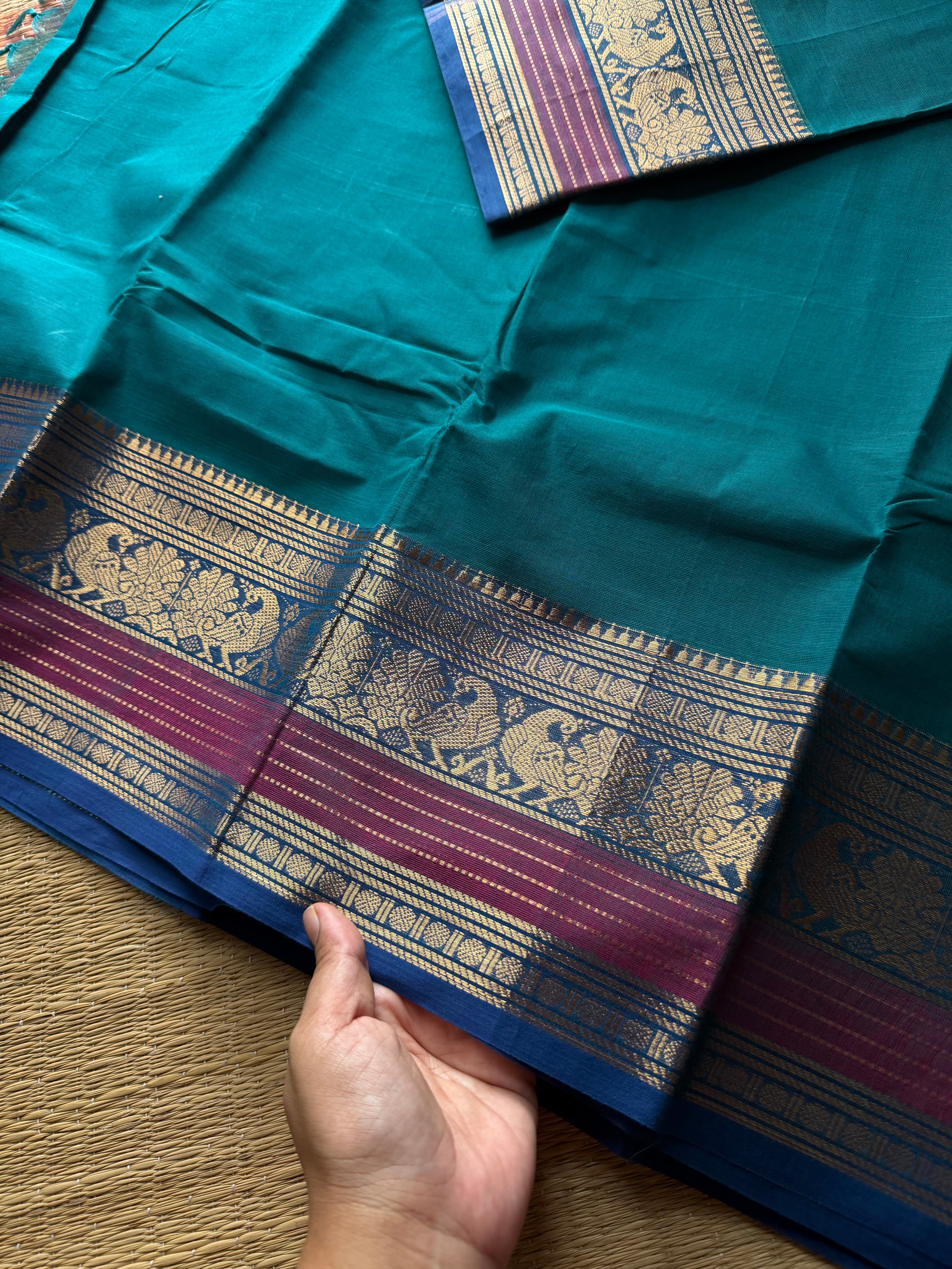 Teal blue shad Kanchi cotton saree with Annam pattern contrast border
