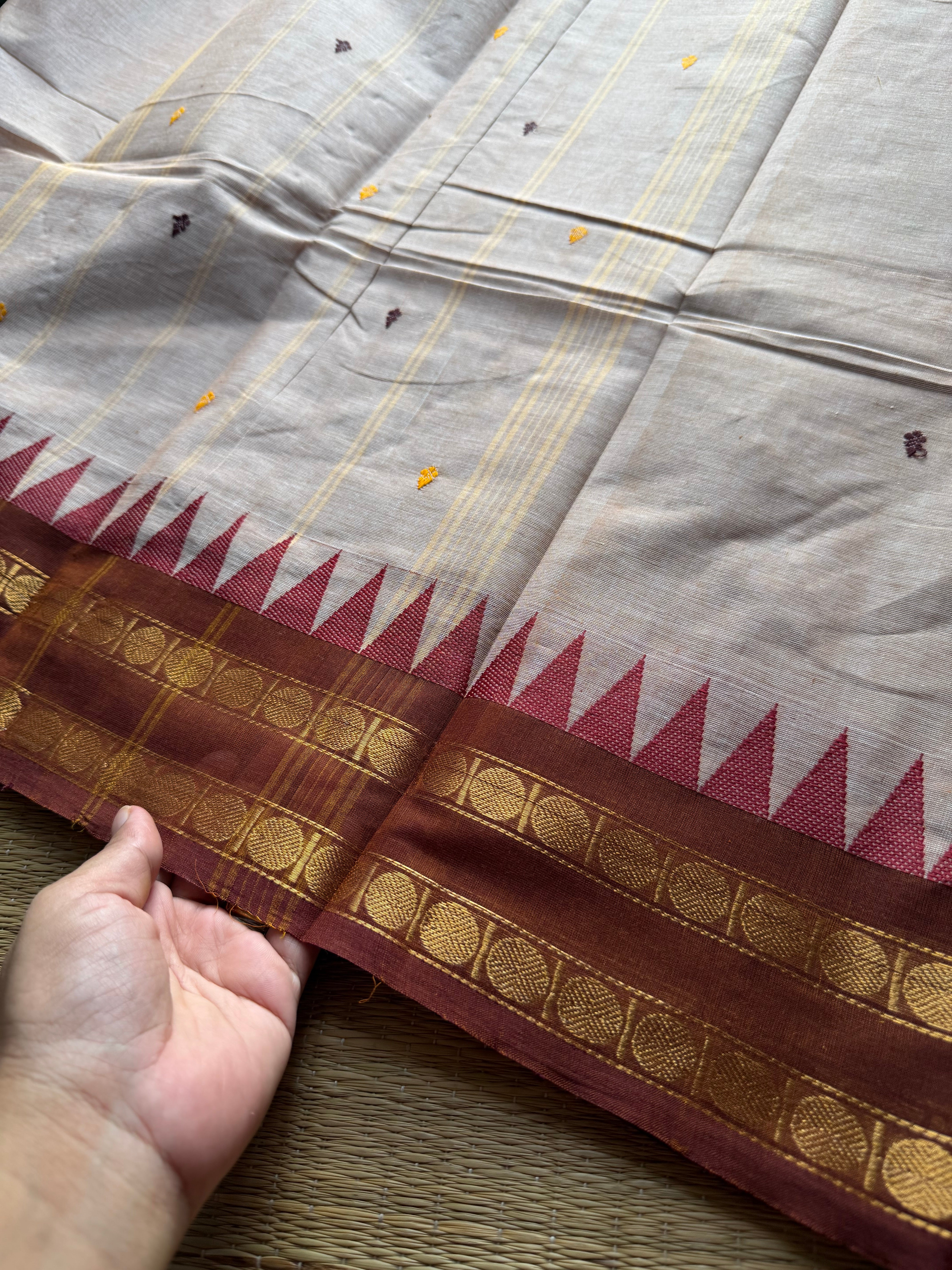 Beige shade Kanchi cotton saree with handmade thread buttas