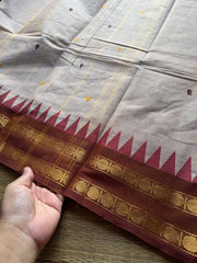 Beige shade Kanchi cotton saree with handmade thread buttas
