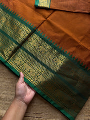 RF1137 Burnt Orange shade with green combination Rettapet border Kanchi cotton saree