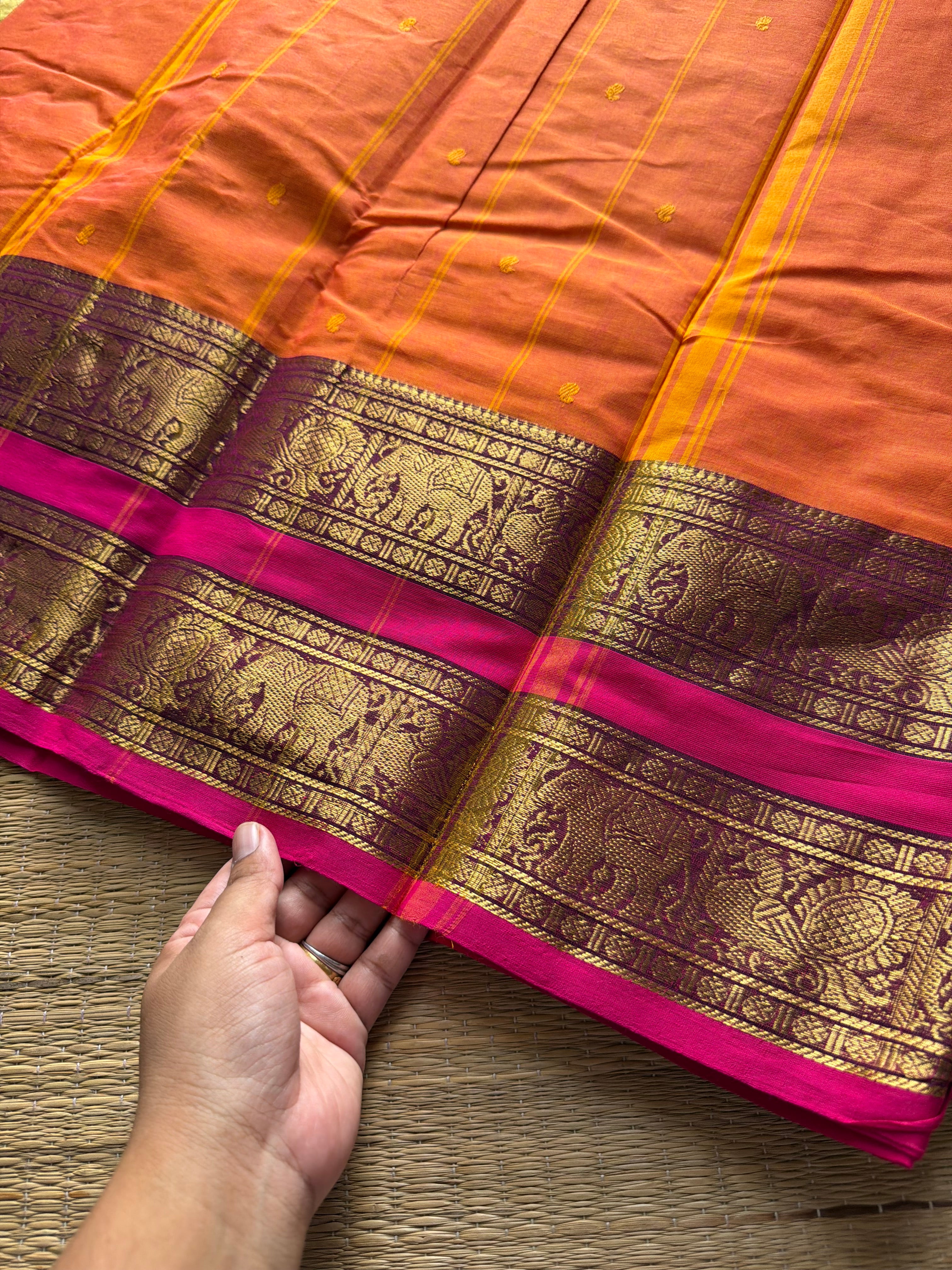 RF701 Orange shade Kanchi cotton saree with Rettapet border & handmade thread buttas