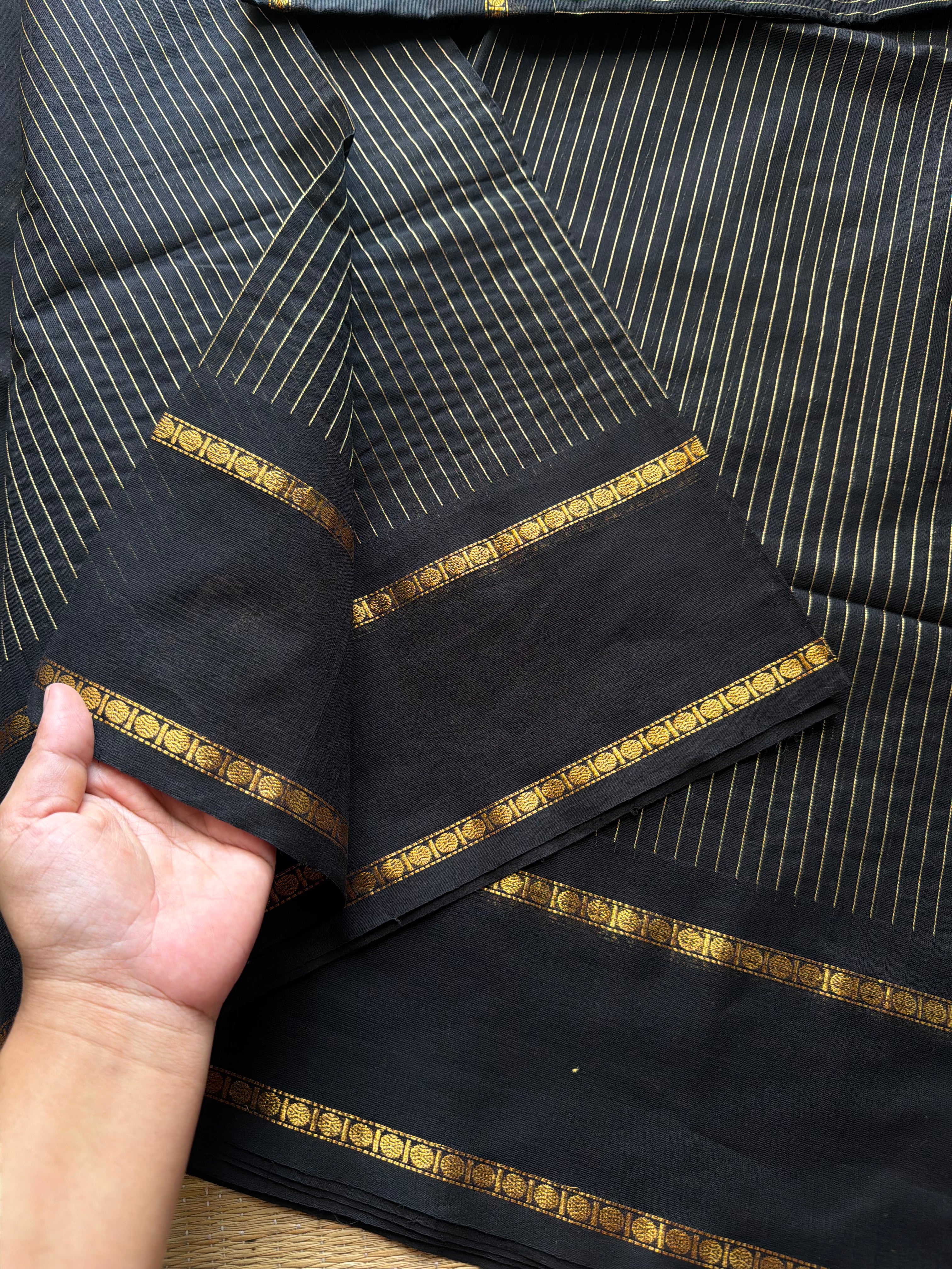 Monotone black shade Kanchi cotton saree with vintage gap border and fully golden Vairaoosi pattern